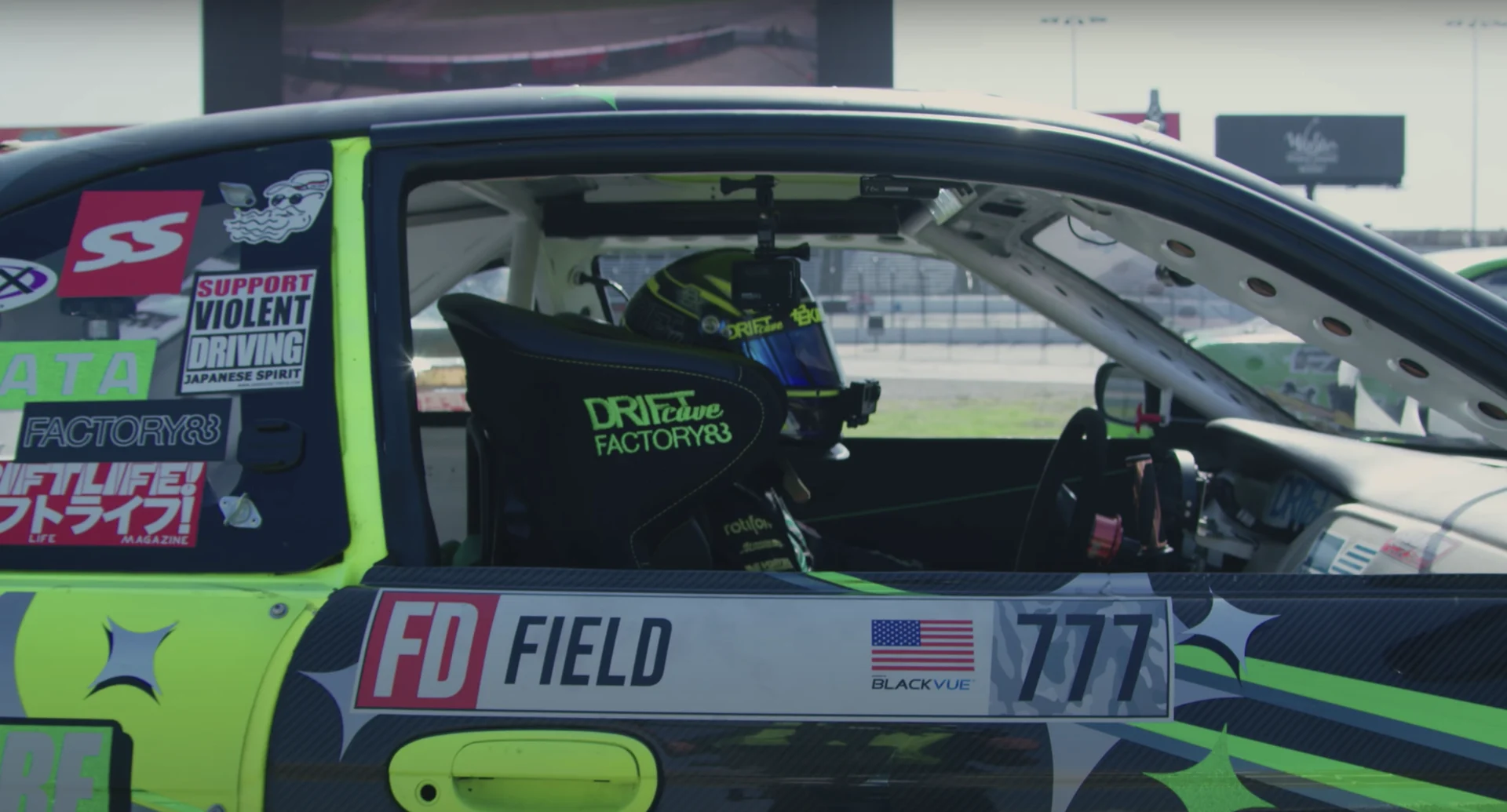 A driver preparing inside a race car